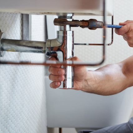 Plumbing SuppliesPlumber working on sink